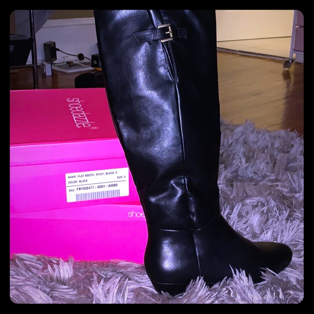 Black leather below knee boots